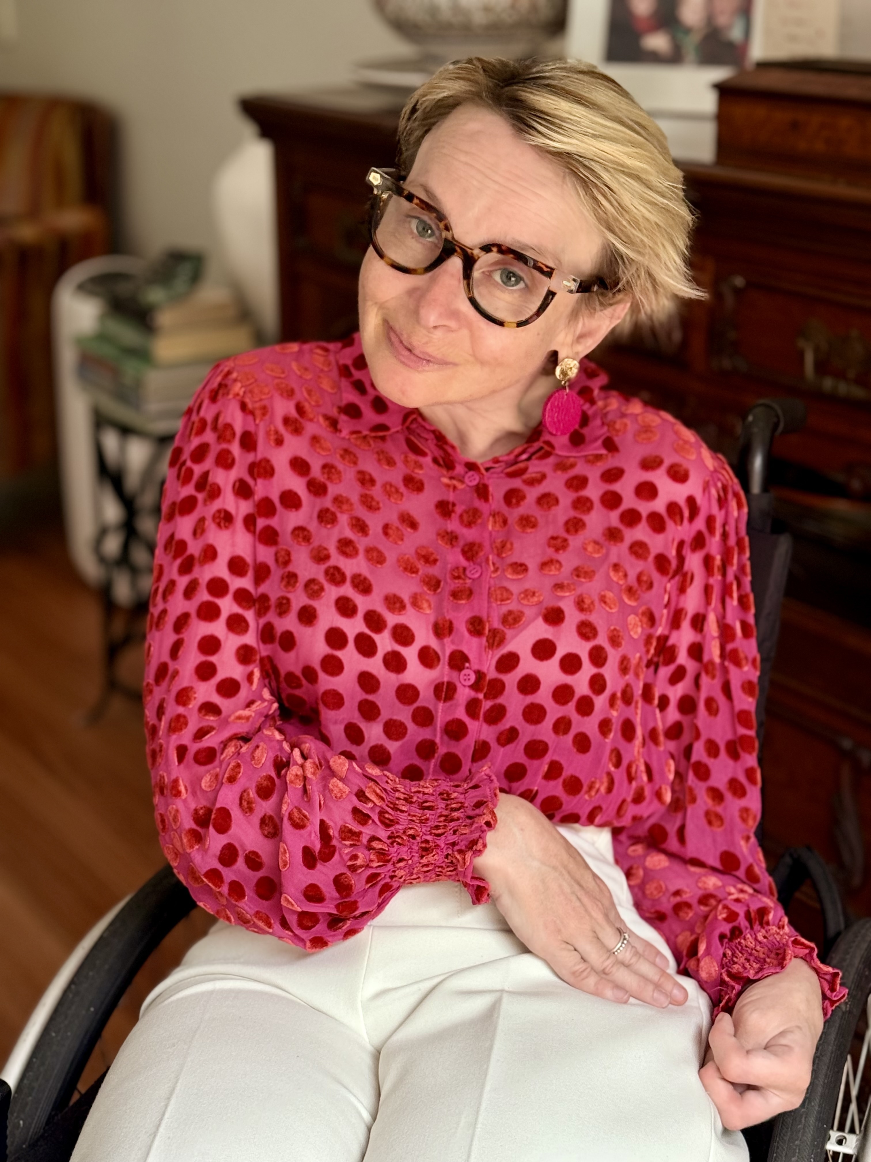 Fiona wearing a bright pink spotted top